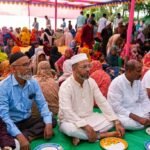 State minister for environment sits on the ground to eat with the homeless in surprise visit to Mongla's 'Ekbelar Mehmankhana'